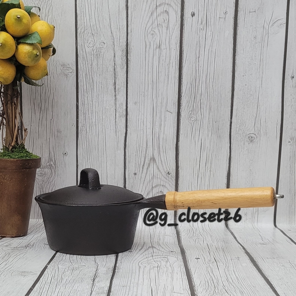Black Cast Iron Saucepan with Wooden Handle and Lid